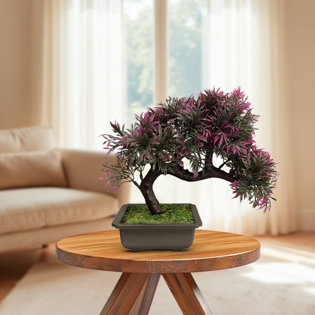 Realistic artificial bonsai plant with curved trunk and lush green leaves