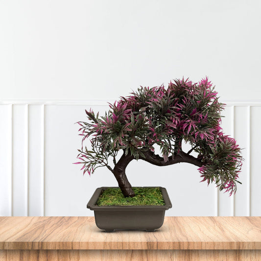Artificial curved bonsai tree with realistic green foliage in decorative pot